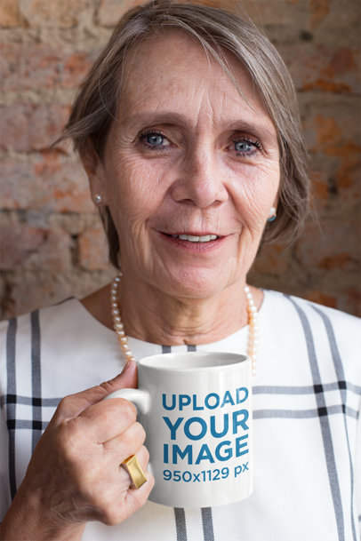 Mockup of an 11 oz Mug in the Hand of an Adorable Grandma