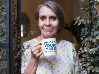 11 Oz Coffee Mug Mockup of a Lovely Grandma Standing at Her Window
