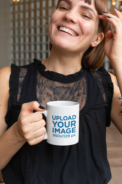 11 Oz Mug Mockup Featuring a Smiling Young Woman with Tattoos