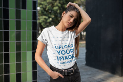 Tee Mockup Featuring a Cool Young Woman Playing with Her Hair 