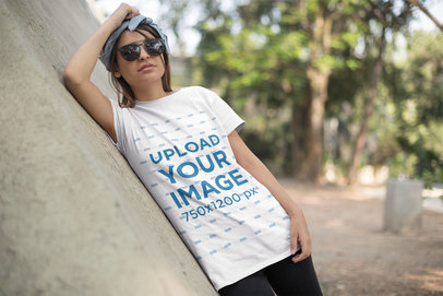T-Shirt Mockup Featuring a Young Woman with a Headband and Sunglasses