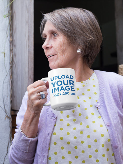 Mockup of a Short Haired Grandma Holding Her 15 Oz Coffee Mug 