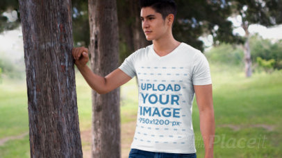 Parallax Video of a Young Man Wearing a Camping T-Shirt Outdoors 