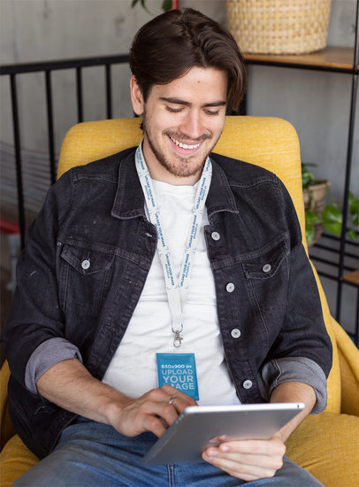 Lanyard Mockup Featuring a Man Checking His Tablet