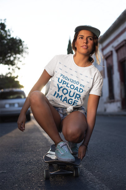 Knotted T-Shirt Mockup of a Woman Riding a Skateboard
