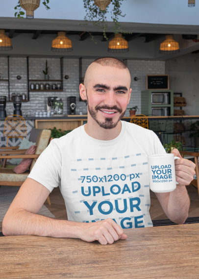 Mockup of a Young Man with a Crewneck T-Shirt Holding a 15 Oz Mug 27520
