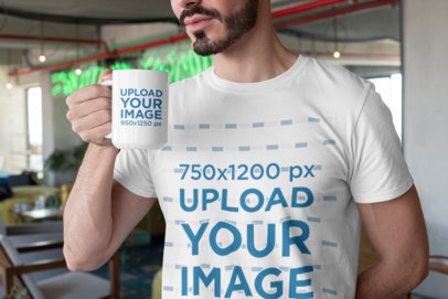Mockup of a Bearded Man with a T-Shirt Holding a 15 Oz Mug 27522