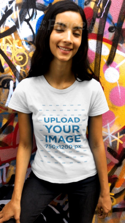 T-Shirt Video of a Dark-Haired Woman Featuring a Grafitti Wall