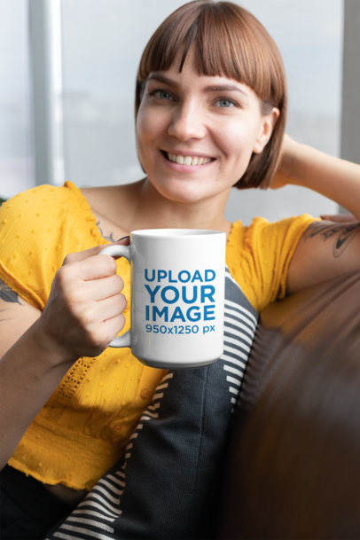 Mockup of a Woman with Bangs Holding a 15 Oz Coffee Mug