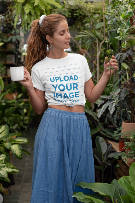 Mockup of a Hippie Woman with a Knotted T-Shirt at a Greenhouse