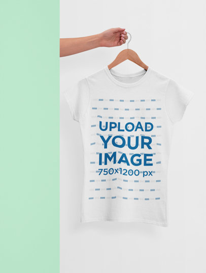 Minimal Mockup of a Hand Holding a Hanger with a Women's T-Shirt 