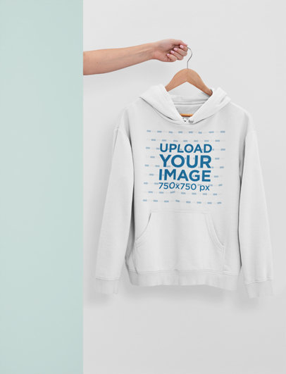 Mockup of a Woman's Arm Showing a Hanged Hoodie