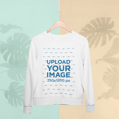 Crewneck Sweatshirt Mockup Hanging Against a Colored Background with Plants Silhouettes