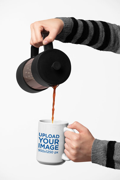 Mockup of Two Hands Pouring Hot Coffee into a 15 Oz Mug