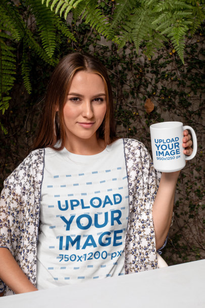 Mockup of a Trendy Woman Wearing a T-Shirt While Holding a 15 oz Mug
