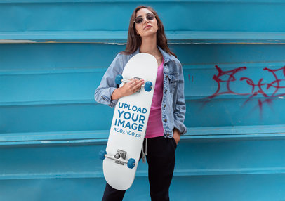 Mockup of a Woman Holding with Sunglasses Holding a Skateboard