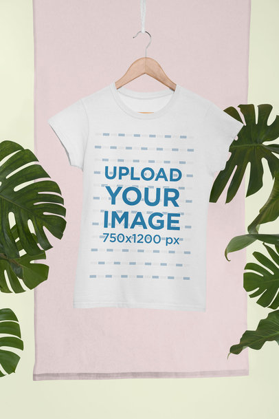 Mockup of a Women's T-Shirt Hanging in a Tropical Setting