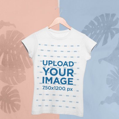 Mockup of a Tee Hanging in Front of a Minimal Colored Background with a Tropical Vibe 27015