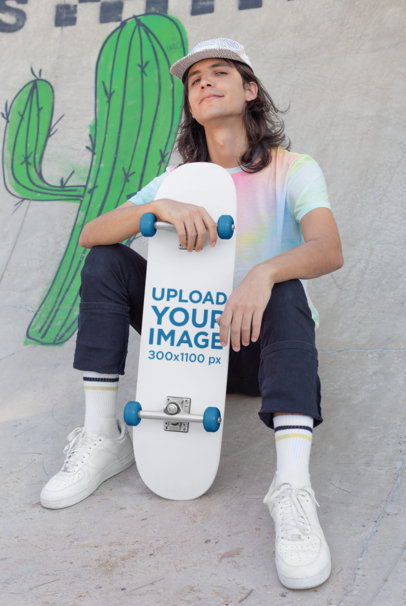 Skateboard Mockup Featuring a Long-Haired Man Sitting on a Ramp 27191