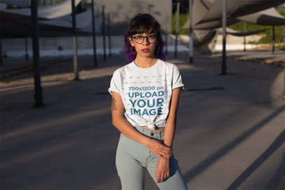 Knotted T-Shirt Mockup Featuring a Tattooed Woman Posing at Sunset 