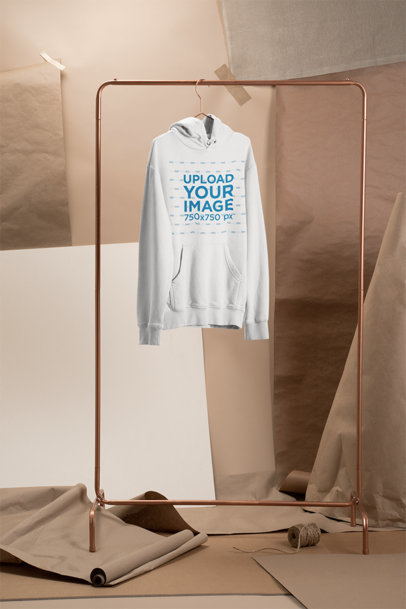Mockup of a Hoodie Hanging at a Craft Stage 27484