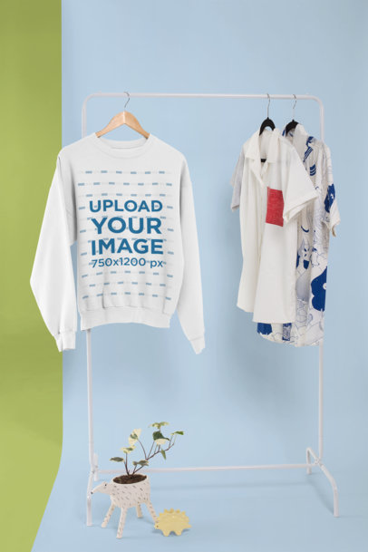 Crewneck Sweatshirt Mockup Hanged in a Rack with Other Shirts