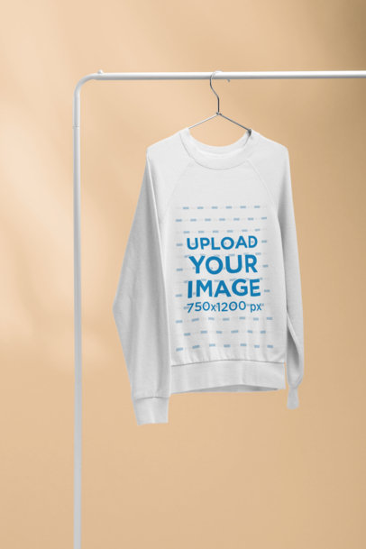 Women's Crewneck Sweatshirt Mockup Hanging from a Rack