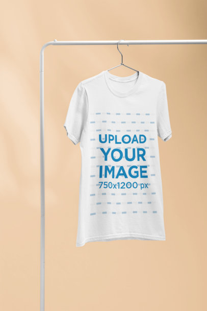Mockup of a Crewneck T-Shirt Hanging from a Steel Rack