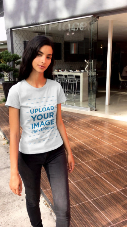 T-Shirt Video of a Slim Woman Walking Down a Street
