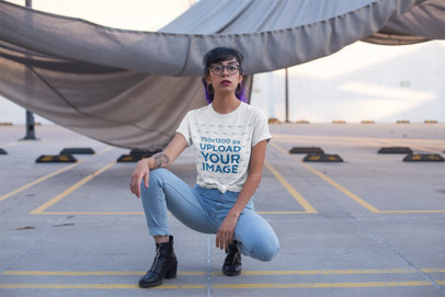 T-Shirt Mockup of an Edgy Woman at a Parking Lot
