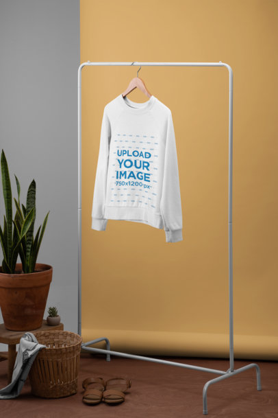 Women's Sweatshirt Mockup Featuring a Minimalistic Setting with Plants