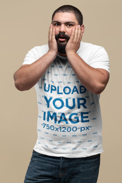 Plus Size T-Shirt Mockup Featuring a Man Holding His Face with Surprise