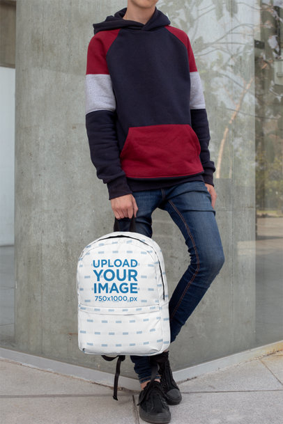 Backpack Mockup Featuring a Teen Leaning on a Concrete Wall 
