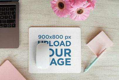 Mousepad Mockup over a Wooden Surface by Some Flowers and a Laptop