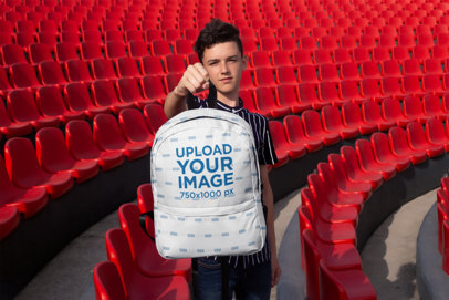 Mockup of a Young Student Holding His Backpack