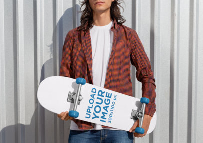 Mockup of a Rebel Man Holding a Skateboard 27201
