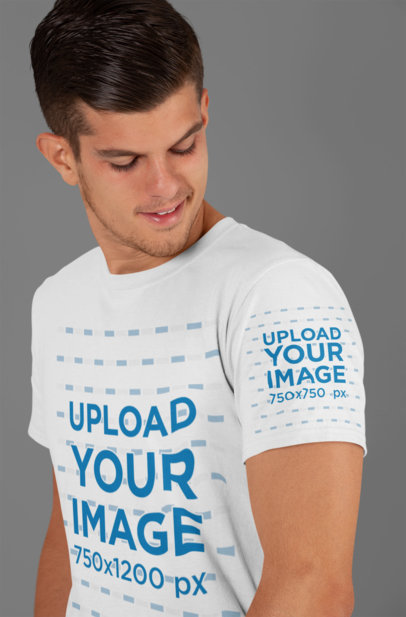 Mockup of a Man Looking at His T-Shirt Sleeve