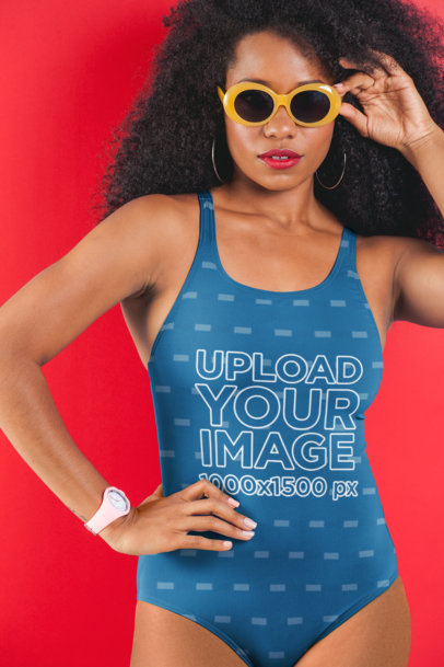 Swimsuit Mockup Featuring a Woman with Sunglasses Posing in Front of a Solid Color Backdrop