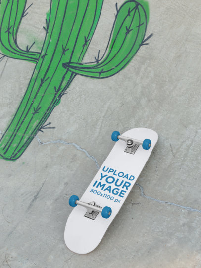 Mockup of a Skateboard Lying on a Graffitied Ramp 