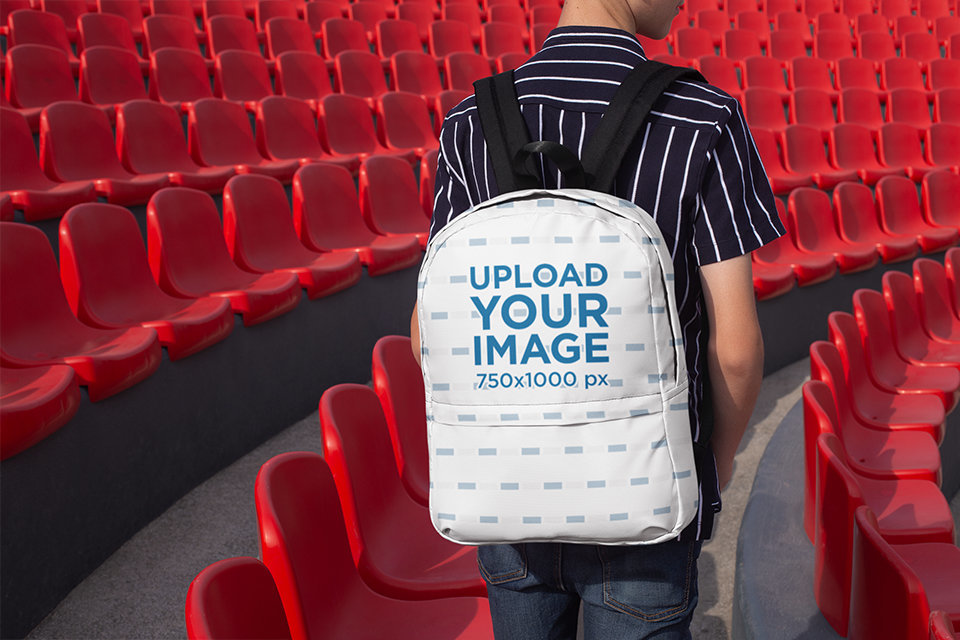 Backpack Mockup of a Kid by Stadium Seats Facing Backward