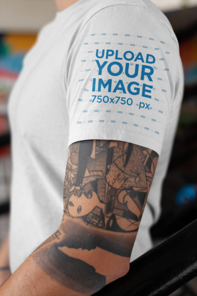 T-Shirt Sleeve Mockup Featuring a Man's Tattooed Arm