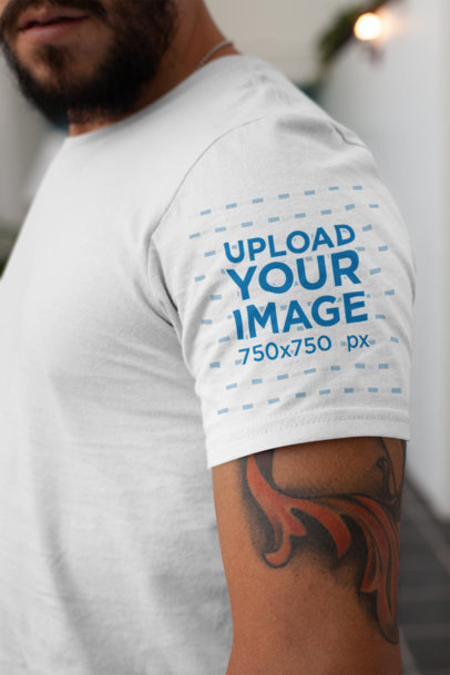 T-Shirt Sleeve Mockup Featuring a Tattooed Man