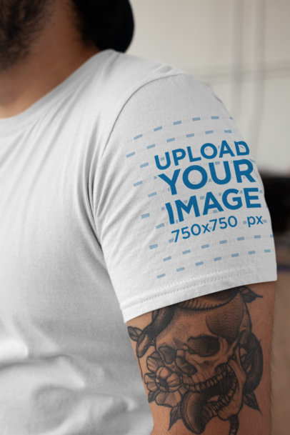 Mockup of a T-Shirt Side View Featuring a Tattooed Man