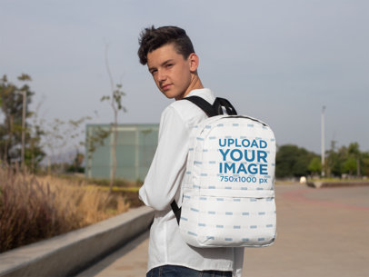 Mockup of a Teenager with a Backpack Looking at the Camera 27698