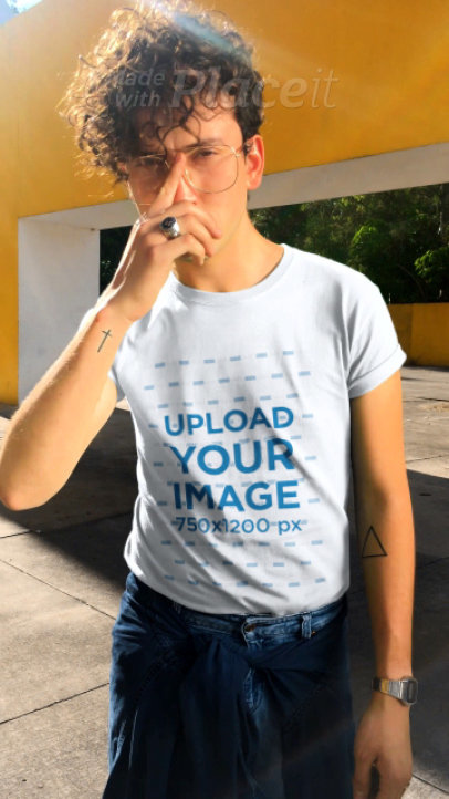 T-Shirt Video of a Curly-Haired Man With Glasses
