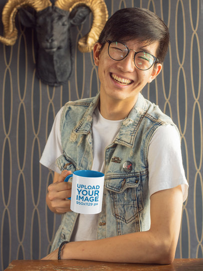 Mockup of a Joyful Man with Glasses Holding a Two-Toned 11 oz Mug
