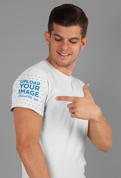 Mockup of a Young Man Pointing at his T-Shirt Sleeve