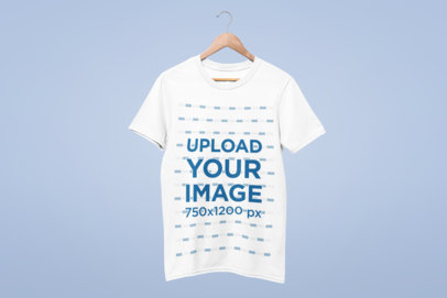 Mockup of a T-Shirt Hanging Against a Solid Background