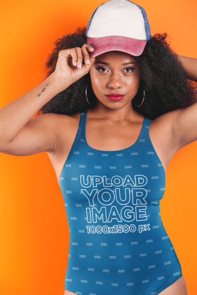 Swimsuit Mockup Featuring a Woman with Kinky Hair Wearing a Cap