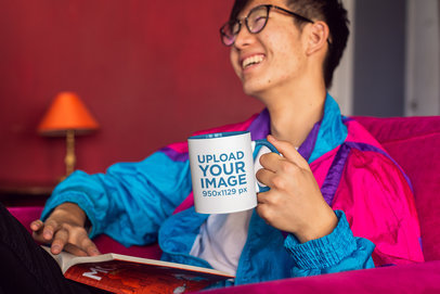 11 oz Colored Rim Mug Mockup Featuring a Joyful Man Reading on a Couch